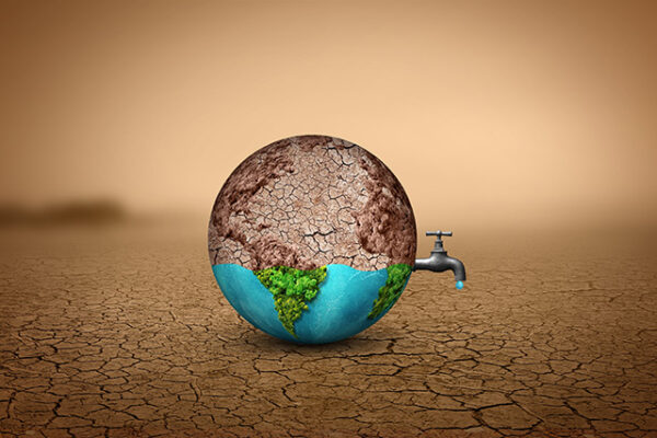 NGC | An earth with a water tap in the middle of a dry desert.