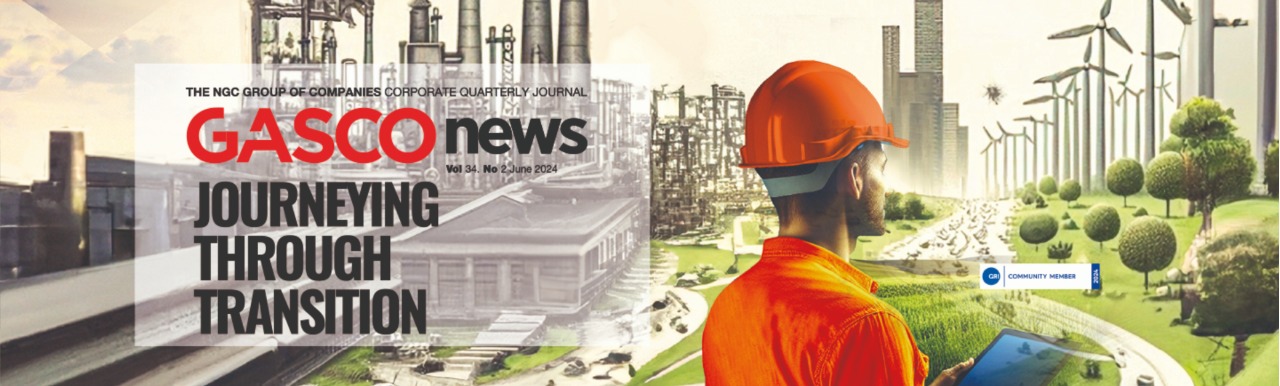 NGC | A person in an orange safety helmet and jacket uses a tablet in an industrial and renewable energy facility. The text reads, "GASCO news: Journeying Through Transition.