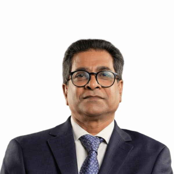 NGC | A man in a dark suit, light shirt, patterned tie, and glasses faces forward with a neutral expression against a plain white background, presenting the professional demeanor expected of a Board of Directors member.