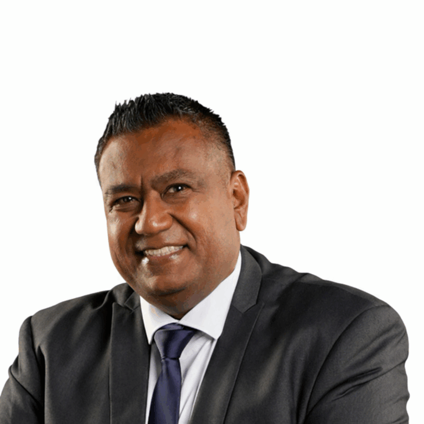 NGC | A man in a dark suit and tie, representing the Board of Directors, smiles at the camera against a plain white background.
